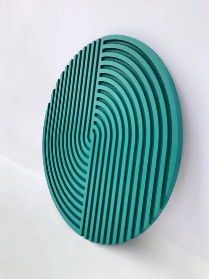This circular abstract piece in teal features a modern design of interlocking arches. It's a unique and stylish addition to any wall.
