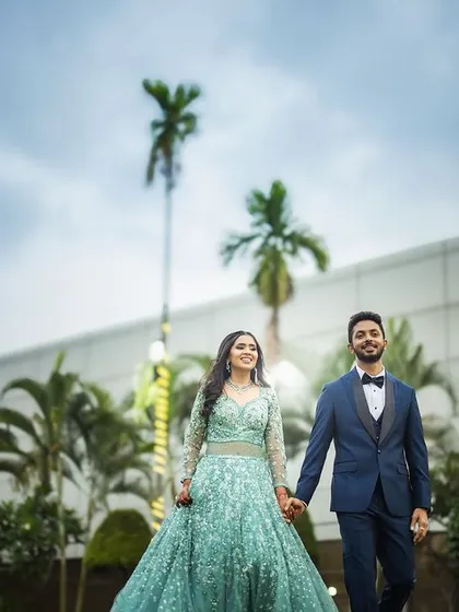 A modern and stylish pre-wedding portrait with a contemporary building in the background. We can tailor the location to match your personal style, whether it's traditional or modern.