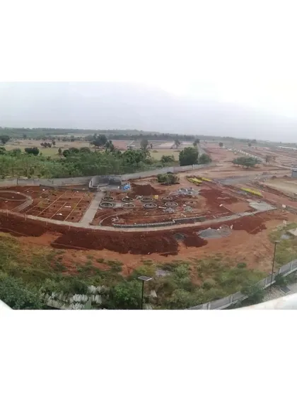 The first step in creation is sculpting the earth itself. This aerial view shows the initial ground shaping for an upcoming community park in Bangalore, where the contours of the land are being formed to create a dynamic and engaging landscape.