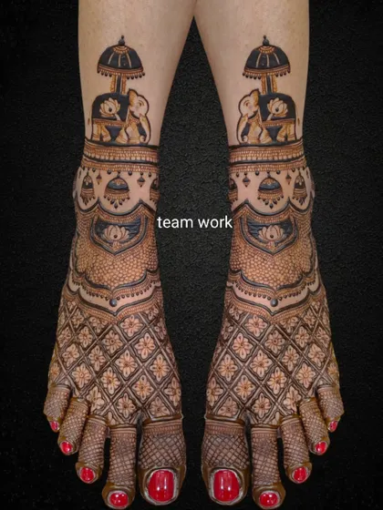 The same elephant-themed bridal foot design on a black background to highlight the intricate details.