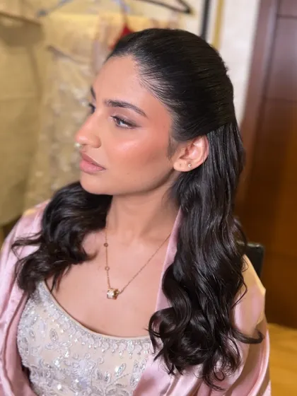 Another angle of the half-up style, perfect for showing off statement earrings.