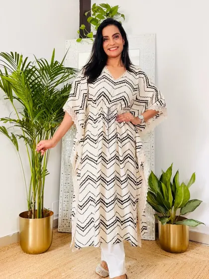A classic black and white chevron print kaftan. This is a chic and modern design that is very versatile.