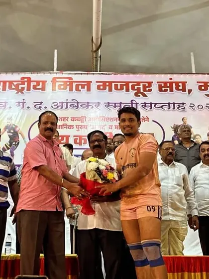 Ajinkya being felicitated on stage by the organizers for his raiding prowess.