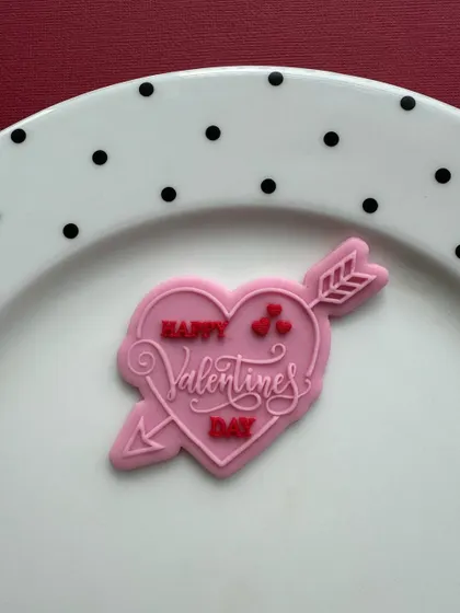 A "Happy Valentine's Day" fondant stamp design, perfect for creating beautiful and detailed cookies or fondant decorations.