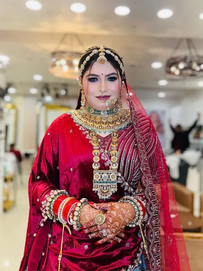The bride looking directly at the camera, showcasing her confidence and the flawless application of her makeup.