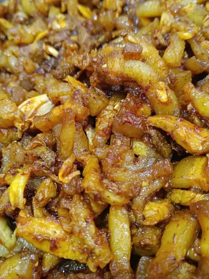 A close-up of the crispy pork fat, showing its texture. This is a popular item for those who enjoy the richer parts of the pork.