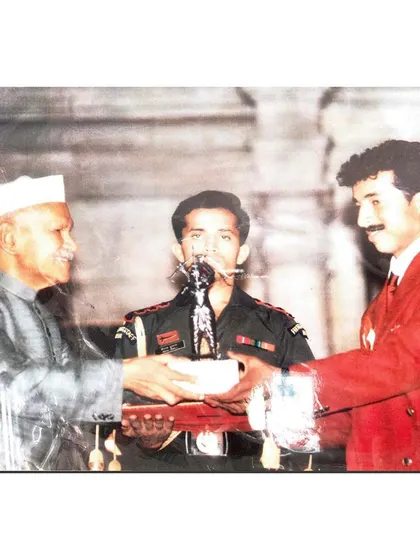 A duplicate image of me receiving the prestigious Arjuna Award, a foundational moment in my journey as a player and coach.