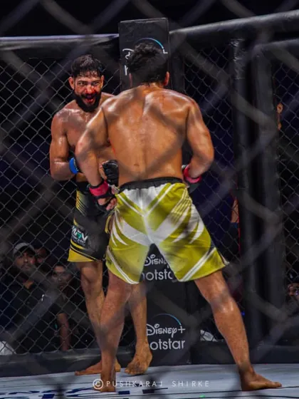 The relentless pressure of a championship bout. Both fighters digging deep in the later rounds.
