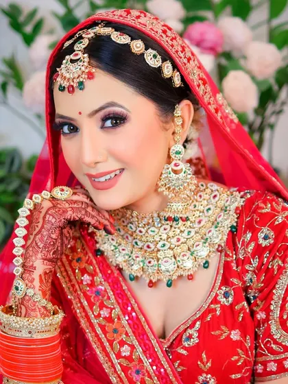 A classic pose that highlights the bride's confidence and the elegance of her attire.