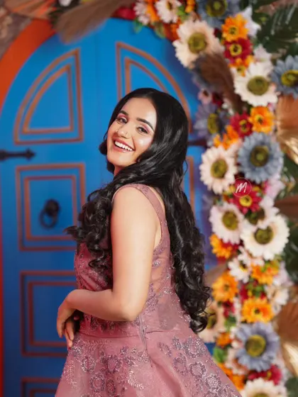 A fun, over-the-shoulder pose that shows off the beautiful hairstyle.