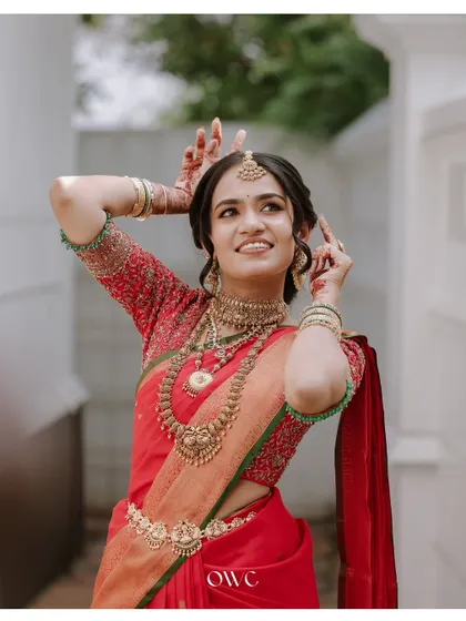 A fun and playful pose from the bride, showing off her vibrant personality.