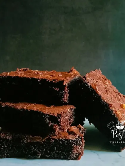 My Chocolate Walnut Brownies are a classic treat. They have that perfect crinkly top and a fudgy, gooey center, packed with crunchy walnuts.