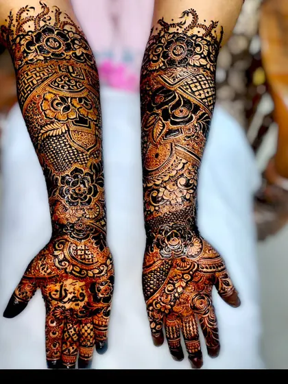 The beautiful dark stain of my organic henna paste, 48 hours after application. This full-arm bridal design shows the rich, deep color you can achieve with proper aftercare.