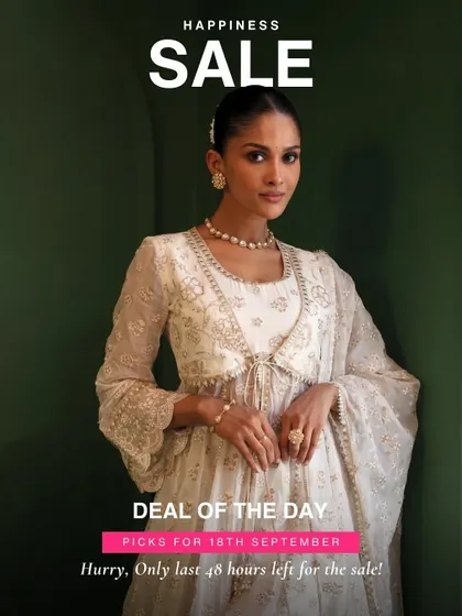 A classic white anarkali is a must have in any ethnic wardrobe. This one, with its delicate tie front detail, is a top deal of the day.