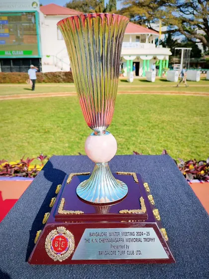 The K.N. Chennabasappa Memorial Trophy, a stunning fluted glass trophy with a silver base.