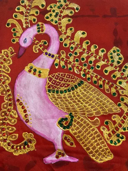 Another variation of the Thanjavur peacock on a rich red background, showing how the same motif can be adapted to different color schemes for custom outfits.