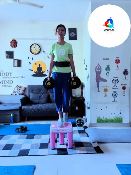 Another client performs step-ups with dumbbells, showing the versatility of this exercise for building lower body strength and power.