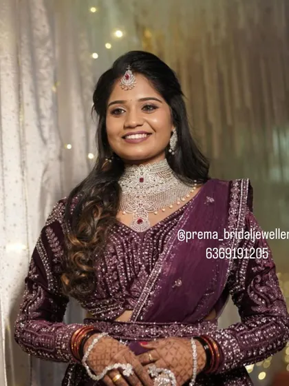 A happy, smiling shot of the bride at her reception.
