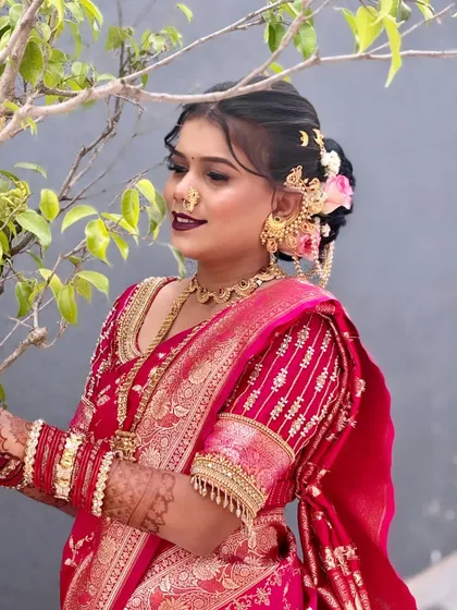 A closer look at an intricate bridal bun adorned with beautiful hair accessories. I specialize in placing hair jewelry securely, ensuring it complements the hairstyle and stays in place without causing discomfort. This is a key part of the traditional bridal look.