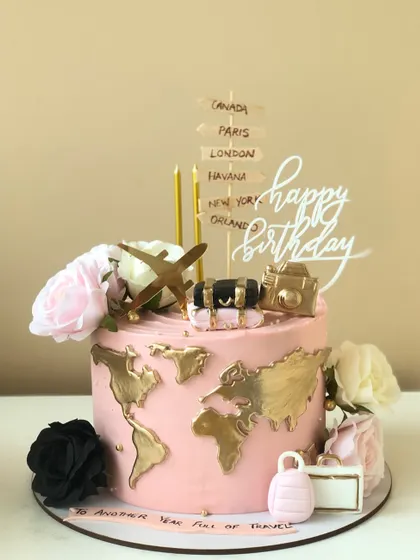 Adventure is out there, and it can be on a cake too. This travel-themed birthday cake features a world map, luggage, and a passport, perfect for the globetrotter in your life.