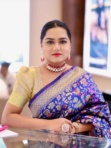 A direct, confident look in the blue saree. This look is perfect for hosting cultural or formal Indian events.