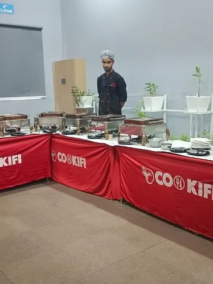 An L-shaped buffet setup to maximize space in a corporate office at Simplilearn. We design our layouts to fit your specific venue requirements.