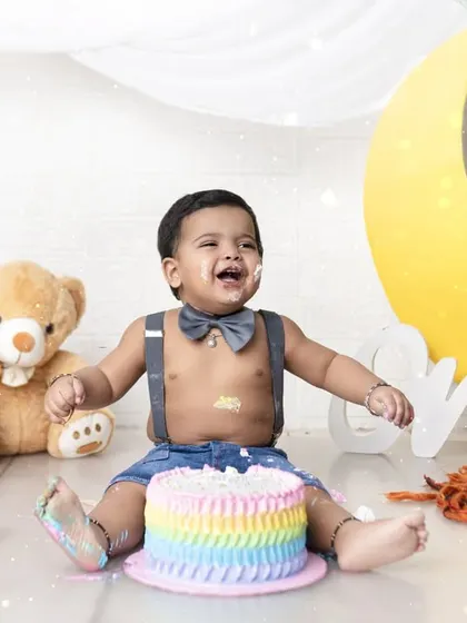 A moment of pure, uninhibited joy during a first birthday cake smash. These sessions are all about letting kids be kids and capturing their genuine reactions.