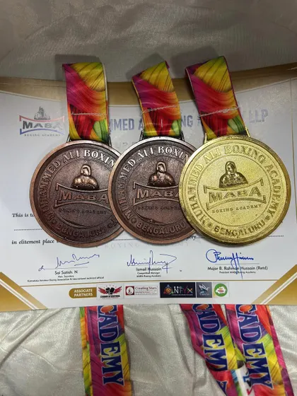 The spoils of victory. The gold and bronze medals won by our team at the Mohammed Ali Boxing Academy Championship. Each one represents a journey of discipline and hard work.