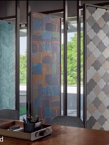 The FCML Tiles showroom in Pune uses transparency to its advantage. The design features rotating panels displaying different tile collections, allowing them to be viewed against the serene backdrop of the surrounding greenery, creating a dynamic and nature-integrated retail experience.