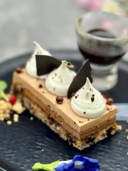 A deconstructed take on our Ferrero Rocher Entremet. Served with a shot of intense coffee or liqueur, this dessert offers a sophisticated, interactive experience for guests.