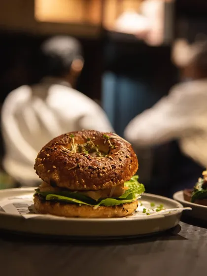 Another look at our sourdough bagel sandwich, a favorite among our regulars. It's the perfect combination of chewy, tangy, and savory.