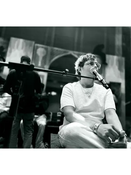 A black and white moment from a sound check, capturing the focus and concentration.