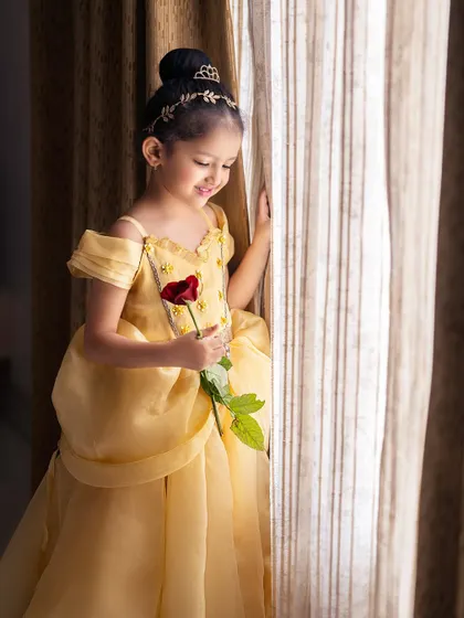 A quiet moment for Princess Belle. The soft window light creates a beautiful, painterly effect in this portrait.