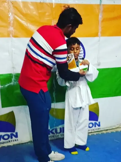 A hug of encouragement for my student. It's more than just coaching.