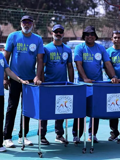 The leadership team stands proudly with our Mintonette Academy ball carts. We are committed to providing a professional training environment.