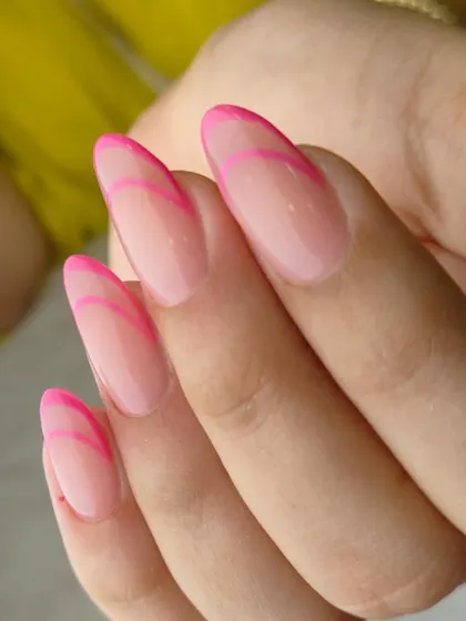 A minimalist yet eye-catching design. This modern French manicure uses two tones of pink to create a simple, graphic outline on a sheer base.