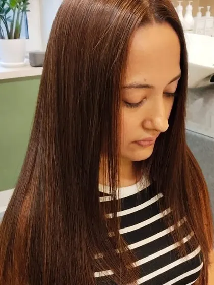 A sleek and straight hairstyle that looks effortlessly polished. This classic look is always in style.