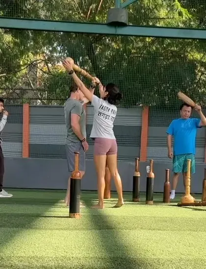 Correcting form and sharing the technique of traditional Indian clubs. It's all about building a strong foundation for powerful, controlled movement.