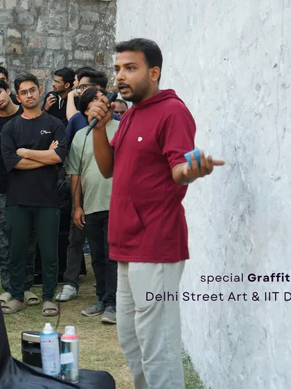 This is me, kicking off the workshop at IIT Delhi. I start by sharing the story of street art and explaining the basics, making sure everyone feels comfortable and inspired before they pick up a spray can. The goal is to demystify the art form.