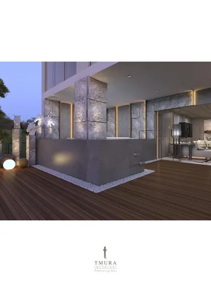 The penthouse terrace was designed as a key entertainment zone. This view shows the outdoor bar area, crafted from concrete and stone, with a clear connection to the indoor living space.