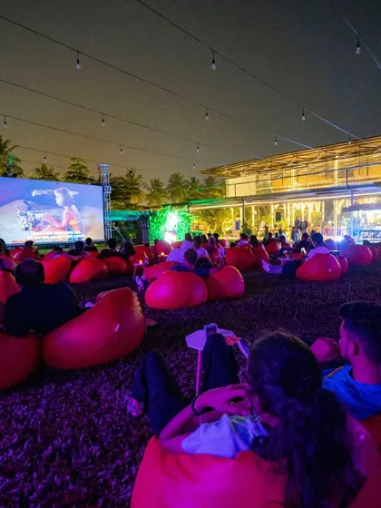 The view from the back of our open-air cinema, showing a full house enjoying the movie.