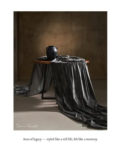 An aura of legacy, styled like a still life, felt like a memory. This composition treats the fabric and decor as elements in a classical painting, focusing on form, shadow, and mood.