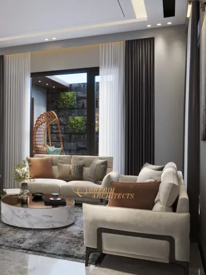 A modern living room with a bold floral wallpaper that serves as an art piece. The design balances this statement feature with neutral sofas and dark curtains.