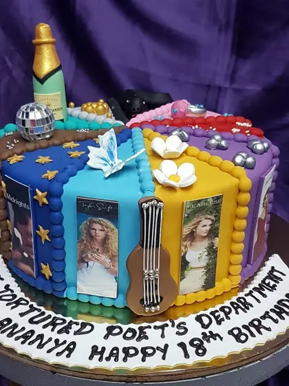 For the ultimate Swiftie. This cake celebrates all the Taylor Swift eras, from "Midnights" to "The Tortured Poets Department," complete with album art and iconic symbols like her guitar. It's a dream cake for any fan.