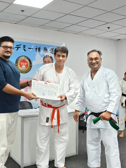 An adult student receiving his new belt. Karate is a lifelong journey, and I welcome students of all ages who are committed to learning and self-improvement.