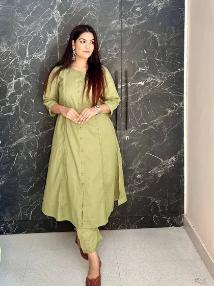 Another angle of the versatile olive green co-ord set, paired with traditional juttis.