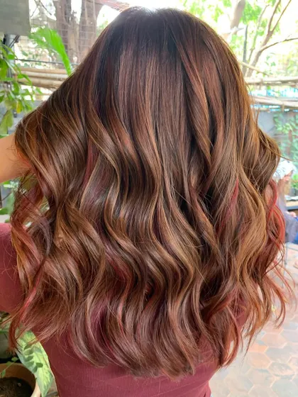 Rich and soft chestnut brown with slivers of red. This is a non-bleach color on previously lightened hair. (No filter)