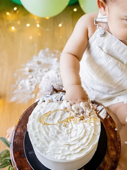 Looking down at the delicious mess he's made. I capture the whole story of the cake smash, from start to finish.