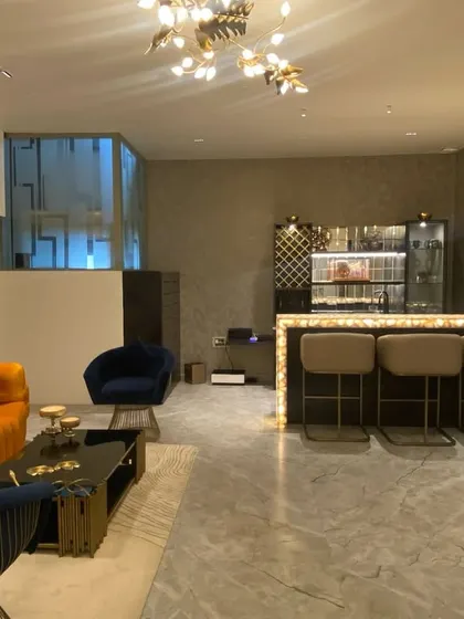 We loved being part of this beautiful entertainment space by Phylosophy Design Studio. Our vibrant orange sofa, deep blue accent chairs, and custom bar stools add a playful yet luxurious feel to this party pad.