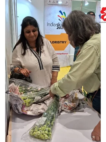Our Director, Seema Jhaveri, inspects the fresh flowers provided to competitors at IndiaSkills 2024. We ensure that all participants have access to high-quality materials to showcase their skills to the best of their ability.